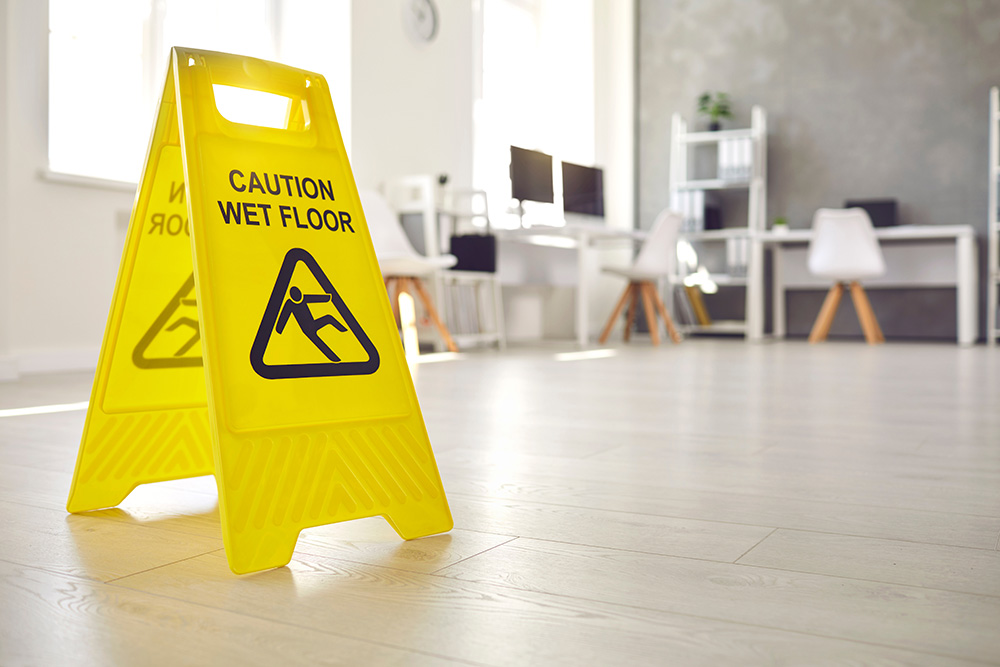 Wet floor sign in an office building after it was cleaned