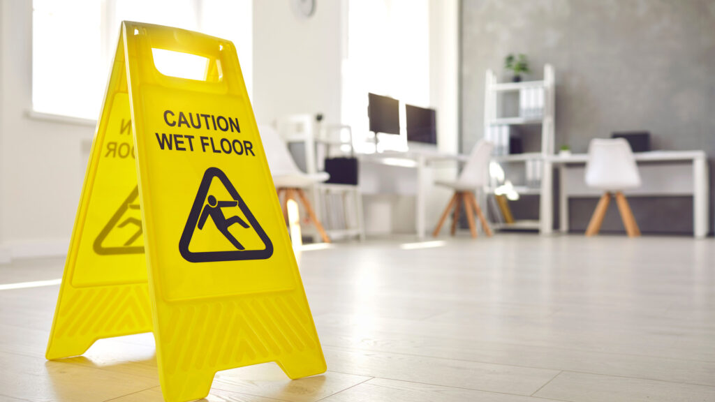 Wet floor sign in an office building after it was cleaned